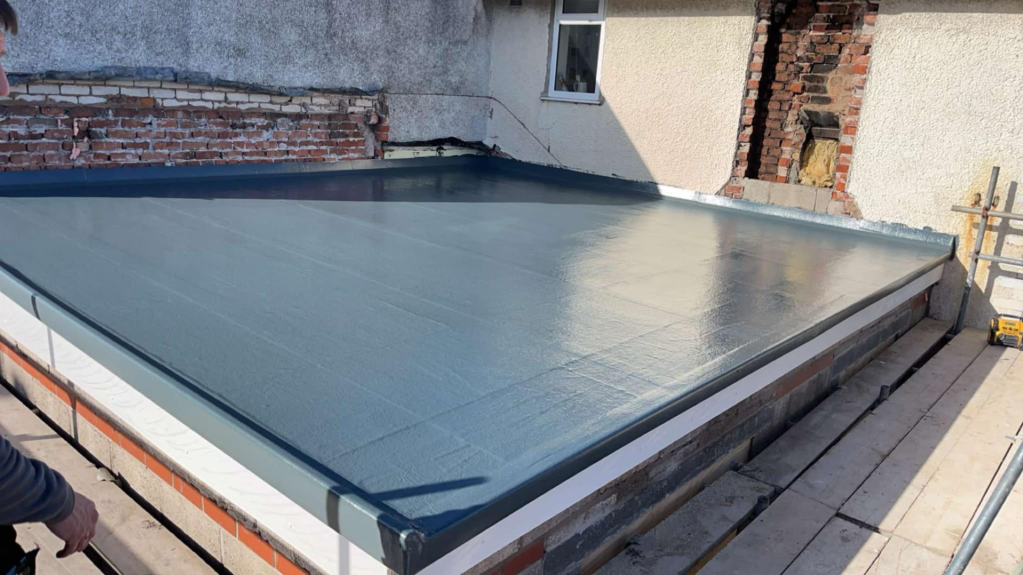 Completed GRP fibreglass flat roof with seamless grey finish in Blackpool
